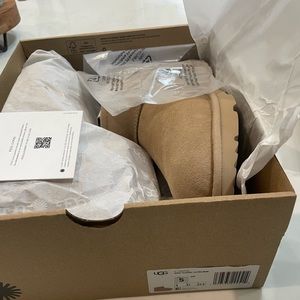 Ultra Mini UGG.  Color is driftwood.  Size 5 kids=size 7 womens